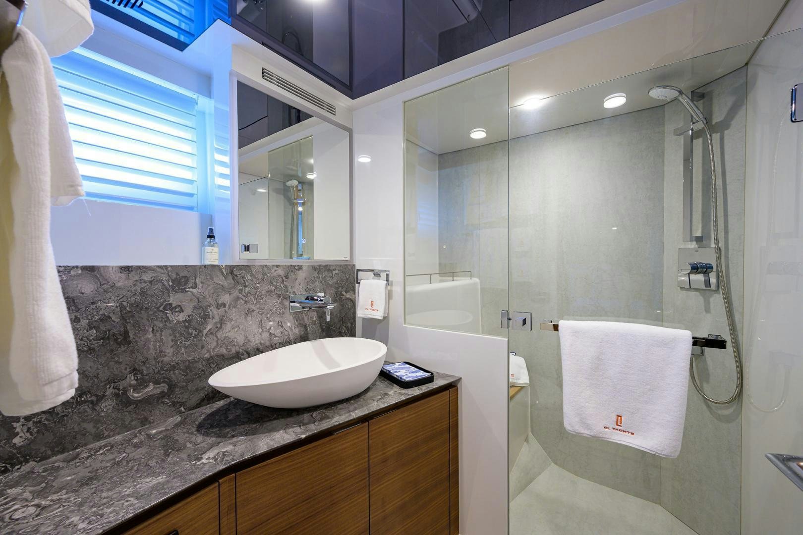 a bathroom with a marble countertop aboard MY 3 GALS Yacht for Sale