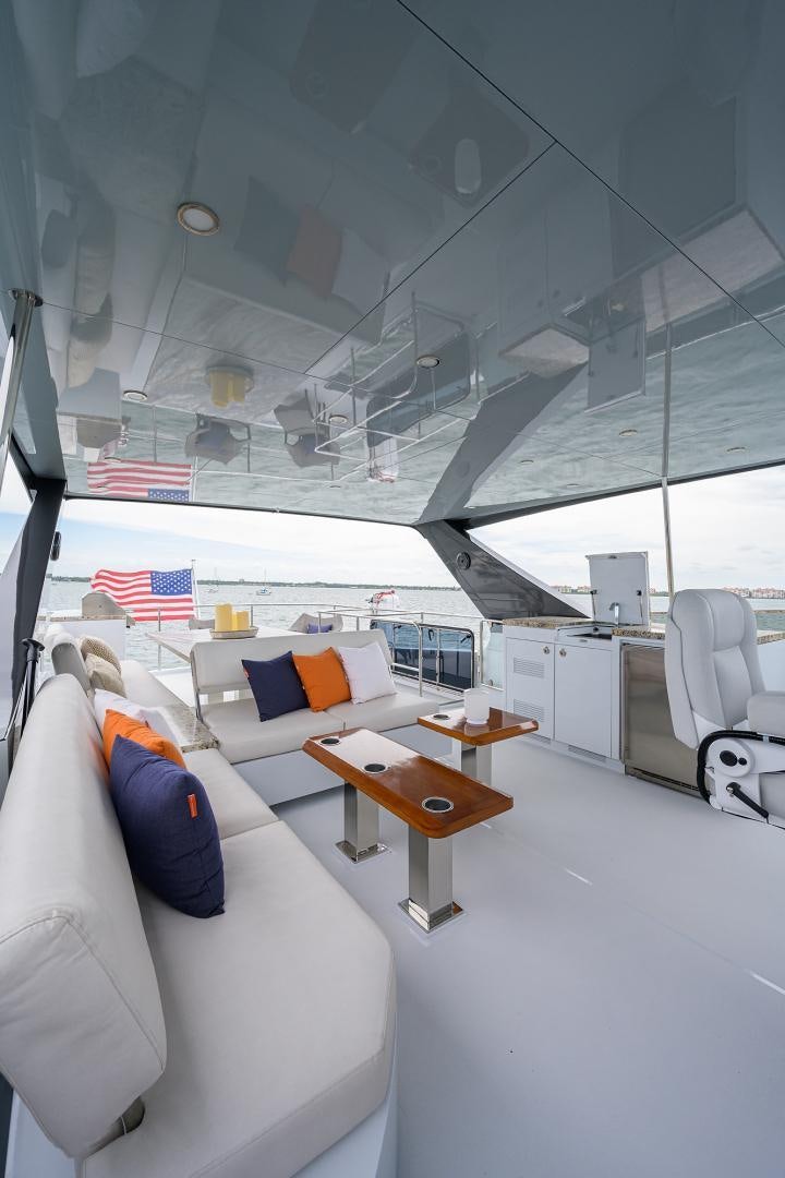 a room with a bed and a desk aboard MY 3 GALS Yacht for Sale