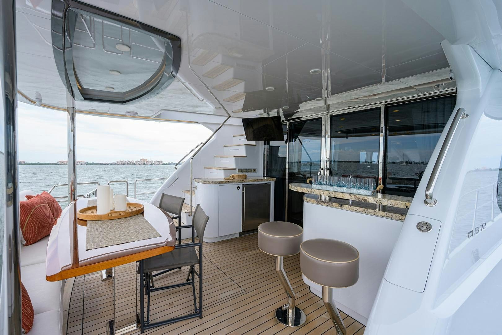 a room with a table and chairs aboard MY 3 GALS Yacht for Sale
