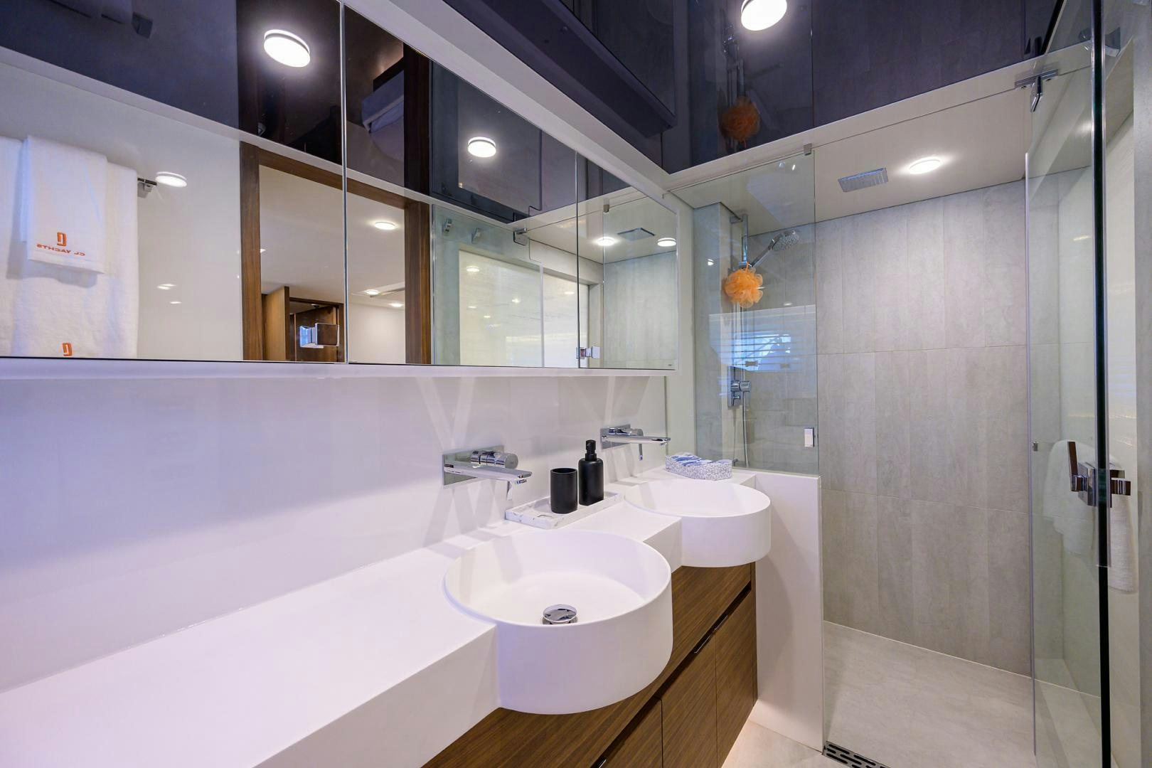 a bathroom with a large mirror aboard MY 3 GALS Yacht for Sale