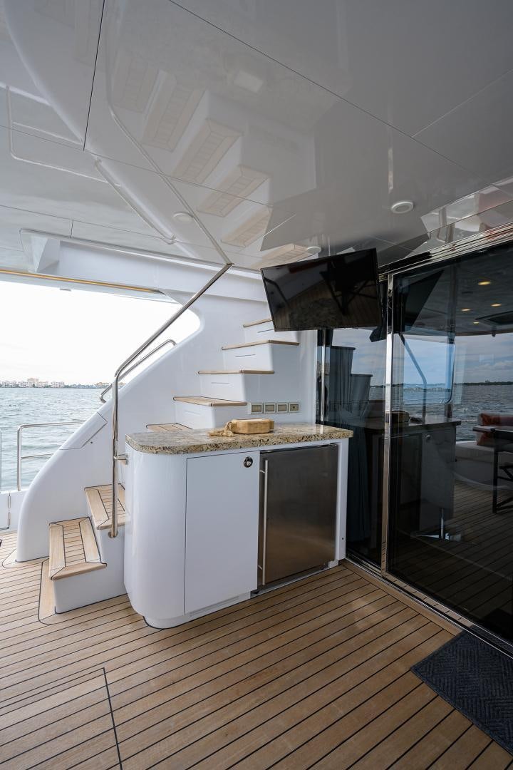 a kitchen with a large glass door aboard MY 3 GALS Yacht for Sale