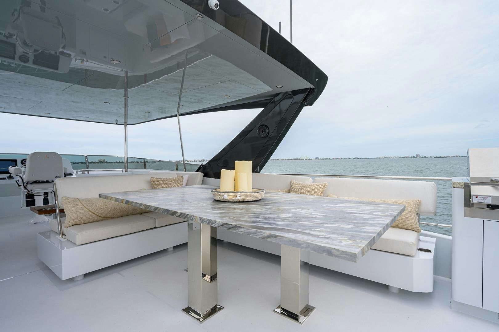 a table with a glass top aboard MY 3 GALS Yacht for Sale