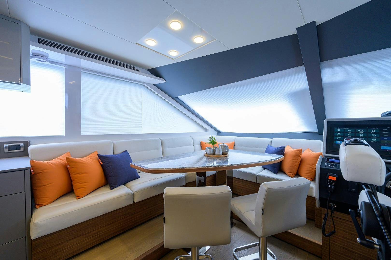 a room with a couch and a table and chairs aboard MY 3 GALS Yacht for Sale