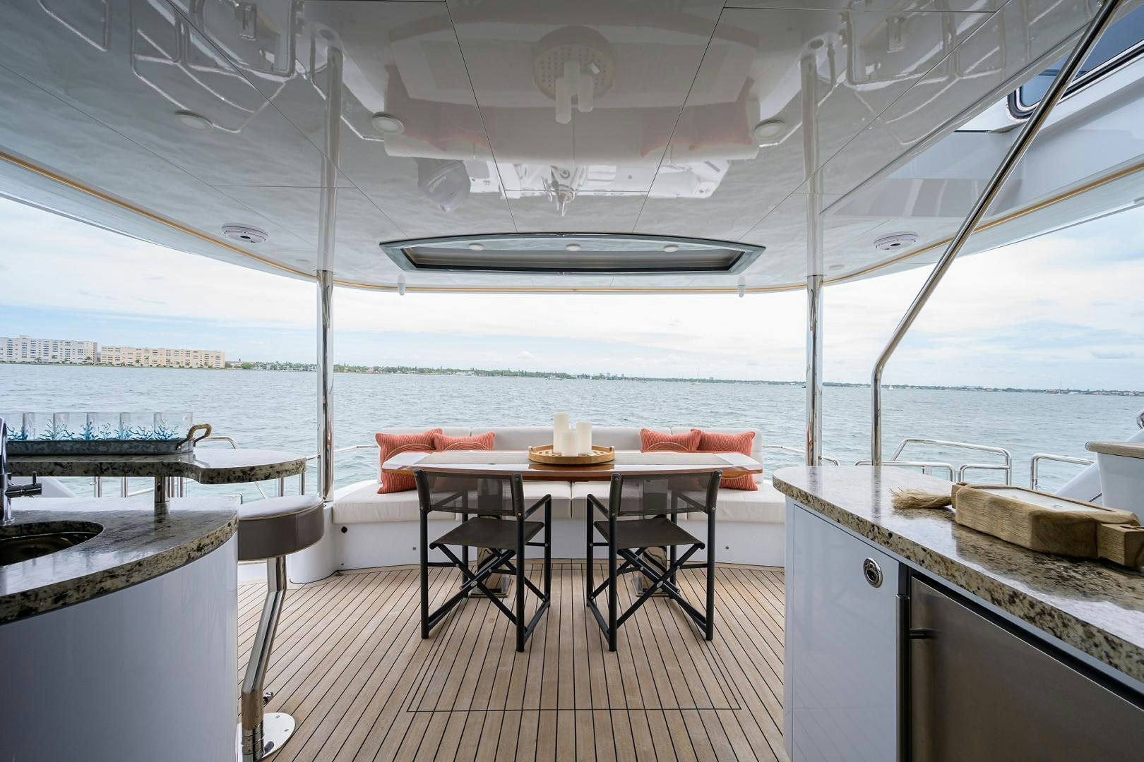 a kitchen with a table and chairs aboard MY 3 GALS Yacht for Sale