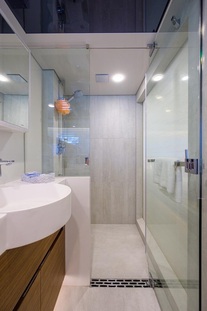 a bathroom with a shower unit and sink aboard MY 3 GALS Yacht for Sale
