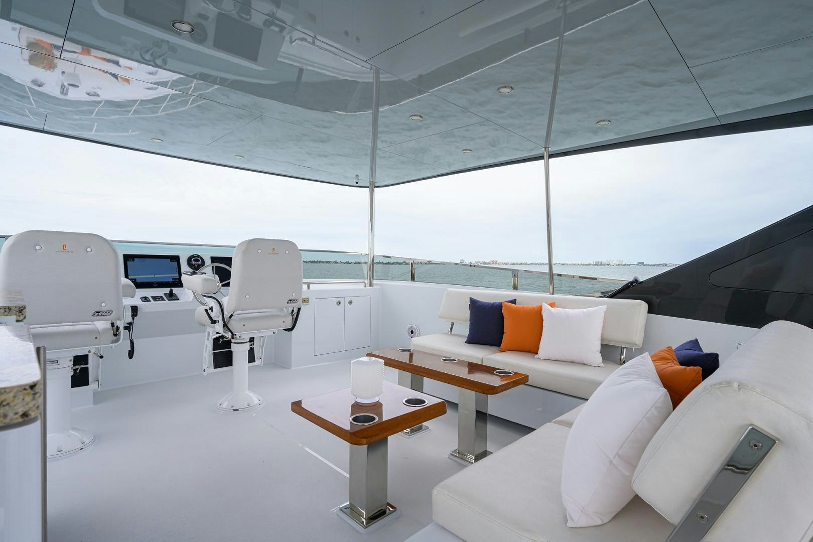 a room with a couch and a table and chairs aboard MY 3 GALS Yacht for Sale