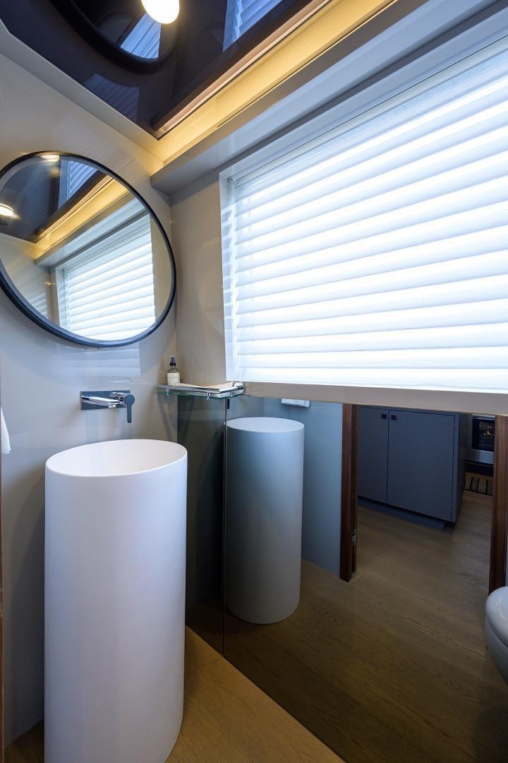 a bathroom with a large mirror aboard MY 3 GALS Yacht for Sale