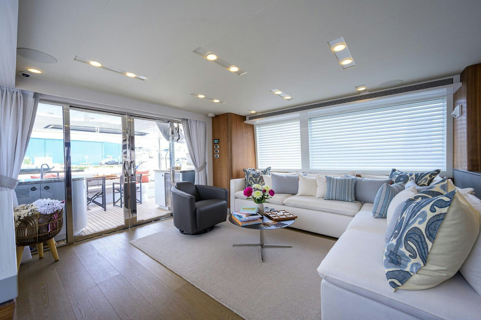 a living room with a large window aboard MY 3 GALS Yacht for Sale