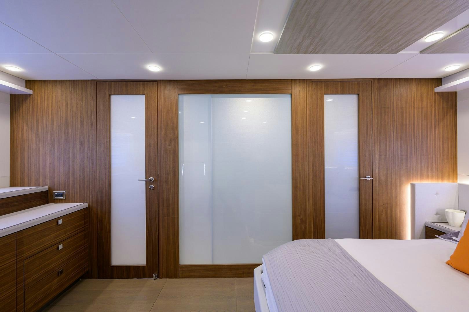 a room with a bed and a closet aboard MY 3 GALS Yacht for Sale