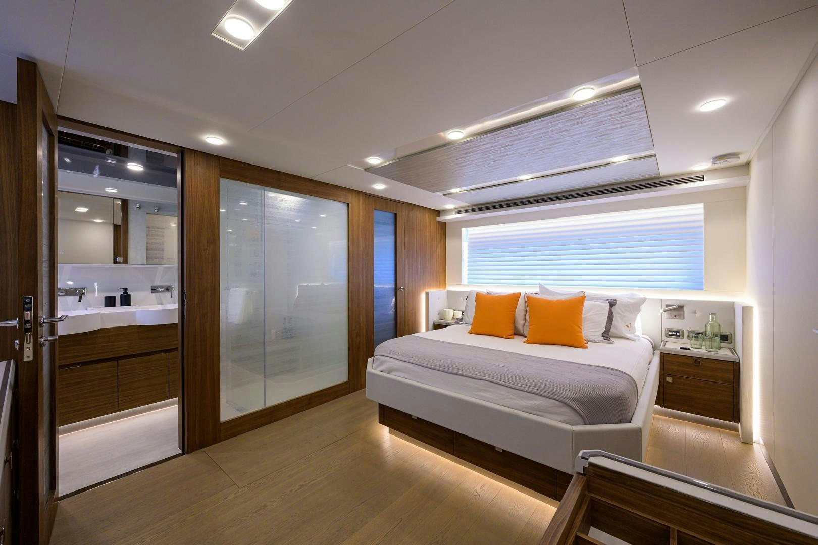 a bedroom with a bed and a mirror aboard MY 3 GALS Yacht for Sale