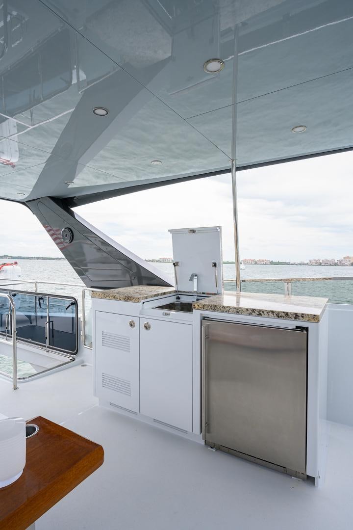 a kitchen with a large window aboard MY 3 GALS Yacht for Sale