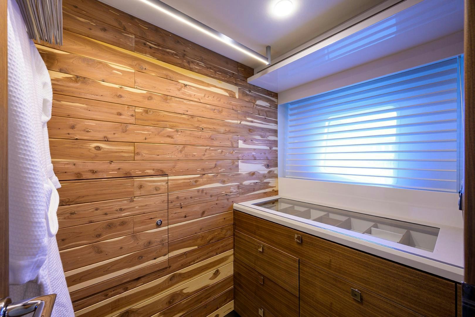 a room with a wood wall and a window aboard MY 3 GALS Yacht for Sale