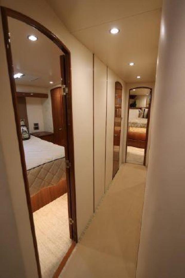 a hallway with a mirror and a bed aboard GABEA Yacht for Sale