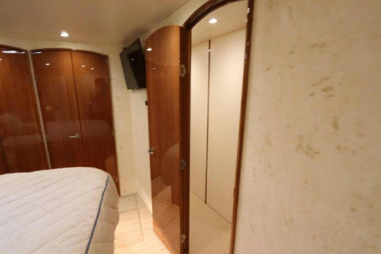 a room with a bed and a door aboard GABEA Yacht for Sale