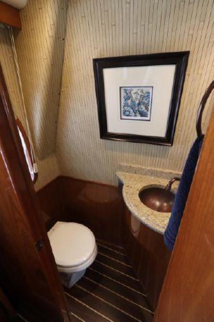 a bathroom with a painting on the wall aboard GABEA Yacht for Sale