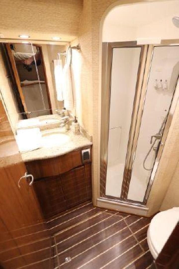a bathroom with a large mirror aboard GABEA Yacht for Sale