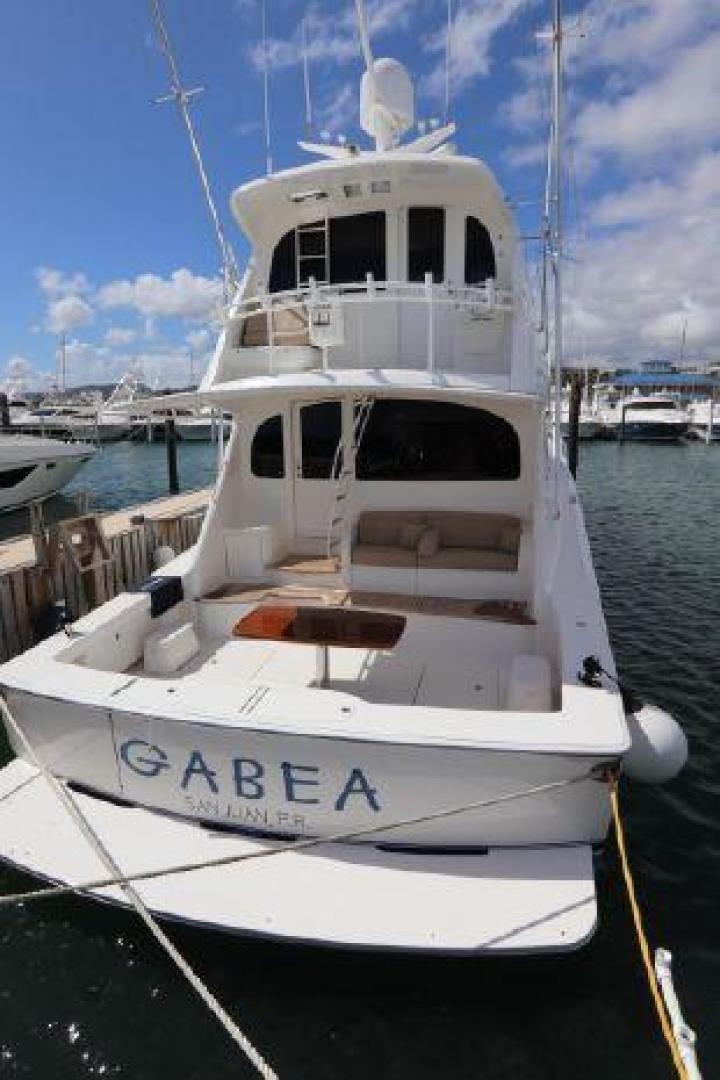 a white boat in a harbor aboard GABEA Yacht for Sale