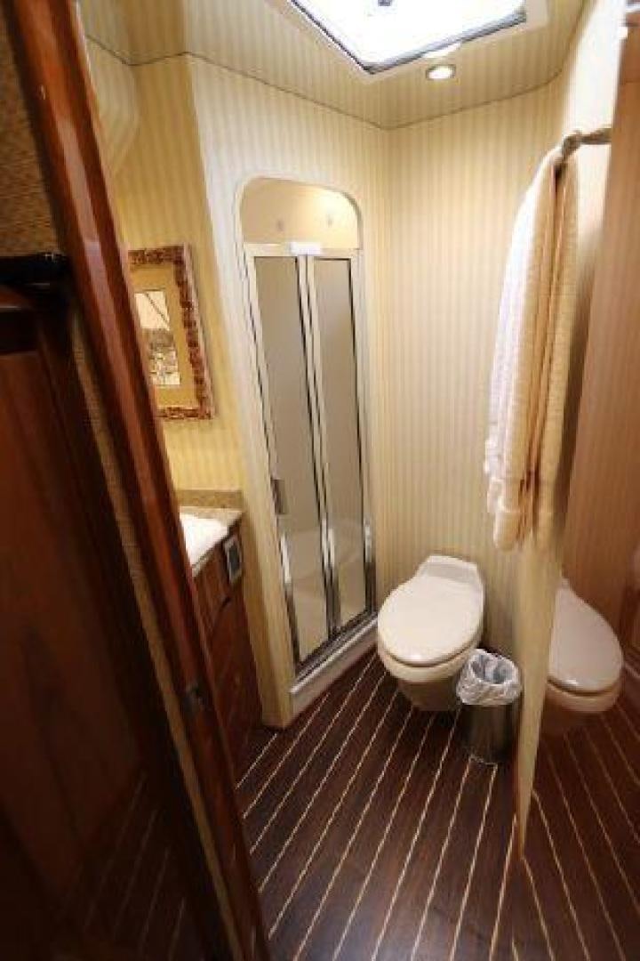 a bathroom with a toilet and a sink aboard GABEA Yacht for Sale