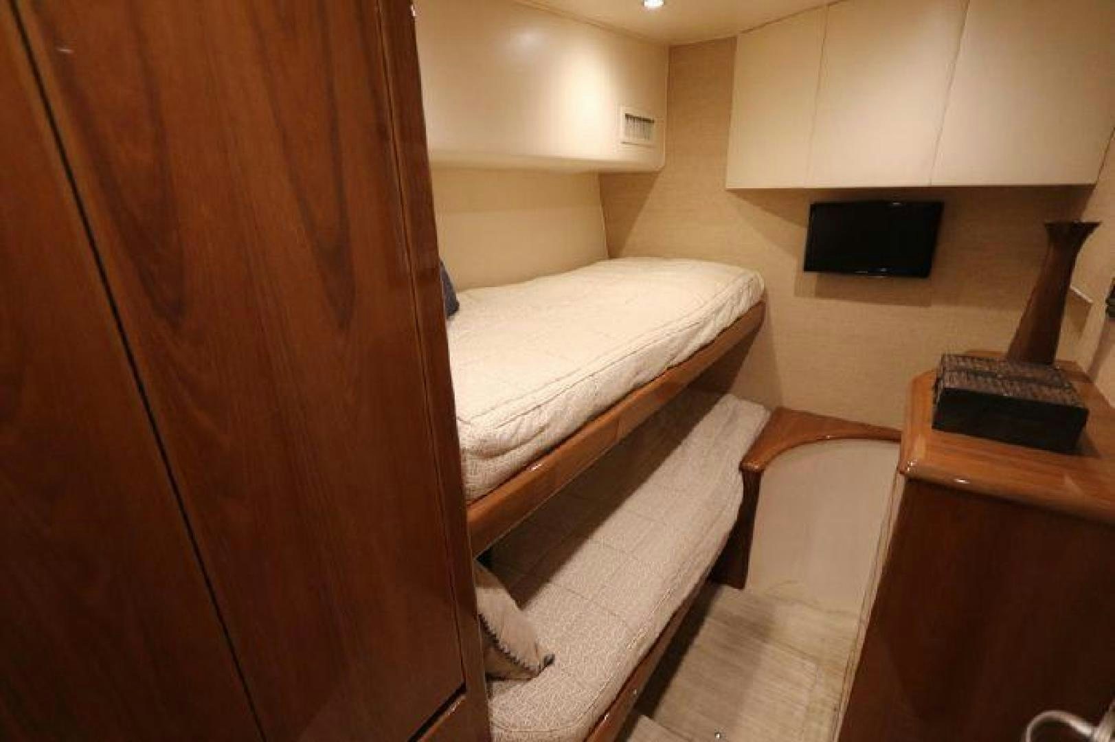 a bed and a desk in a room aboard GABEA Yacht for Sale