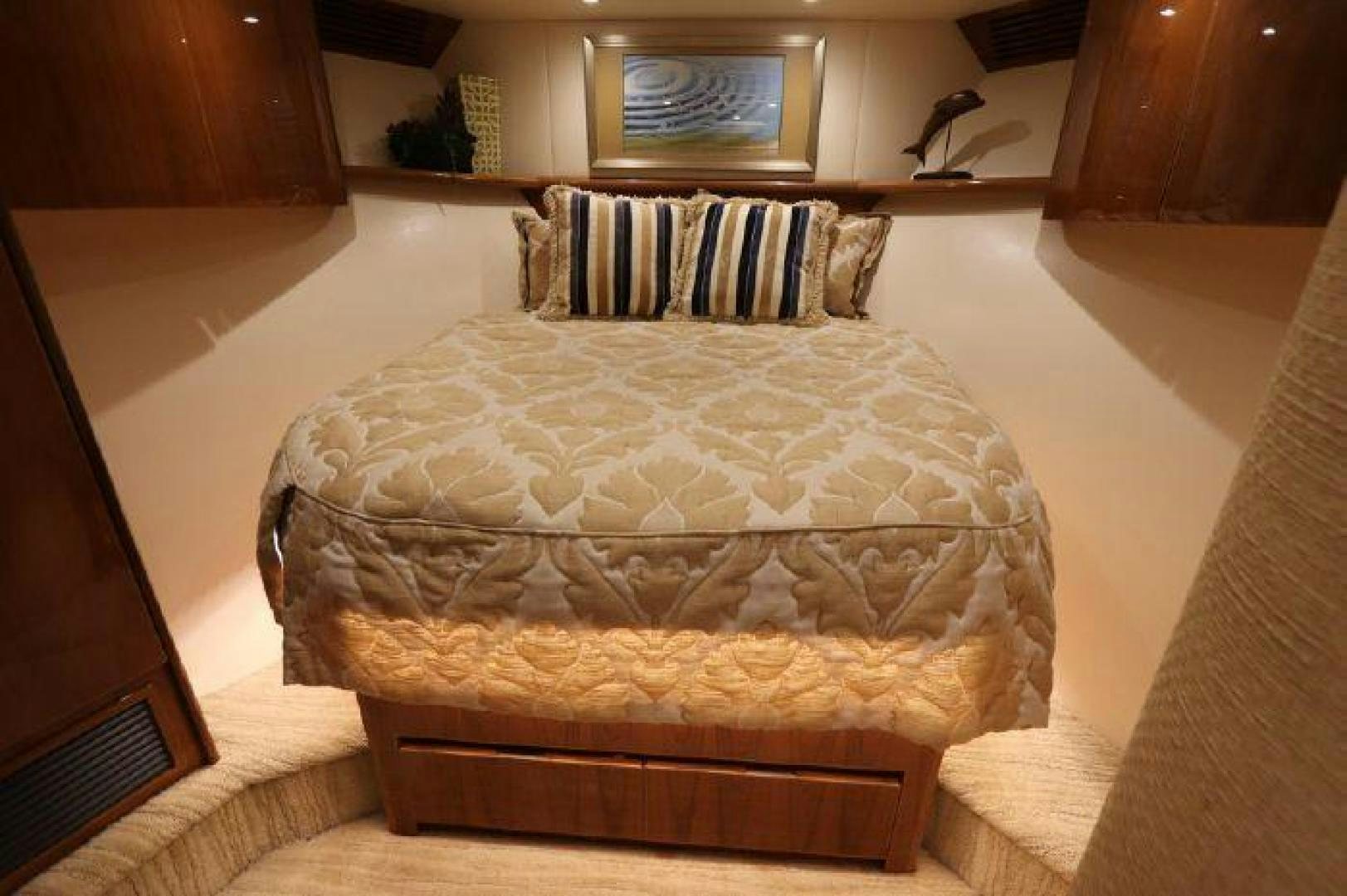 a bed with a white comforter aboard GABEA Yacht for Sale