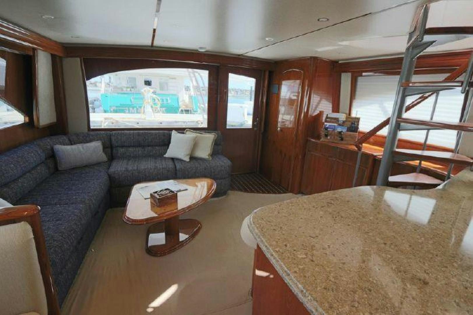 a living room with a couch and a table aboard GABEA Yacht for Sale