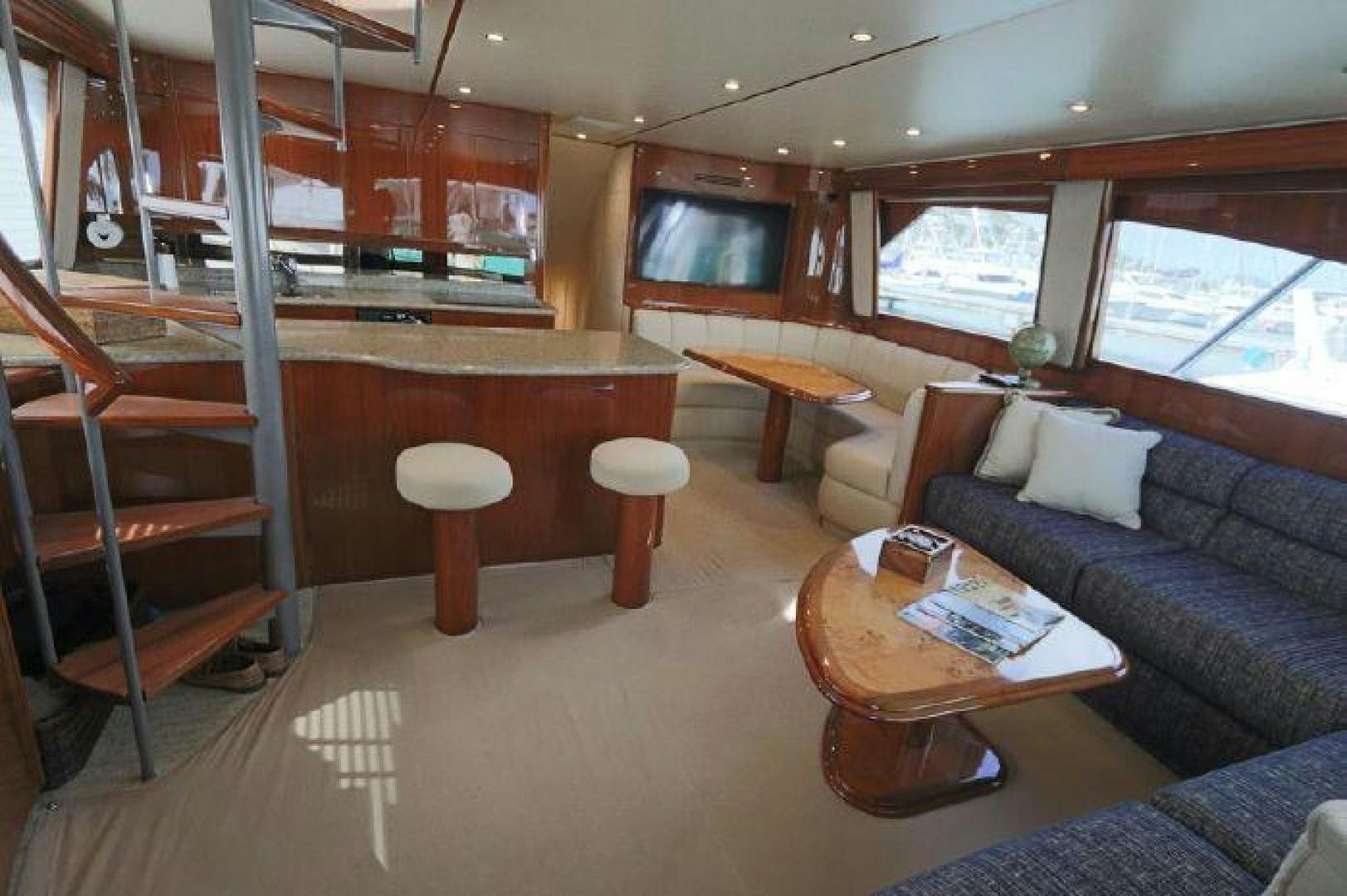 a living room with a couch and a table aboard GABEA Yacht for Sale