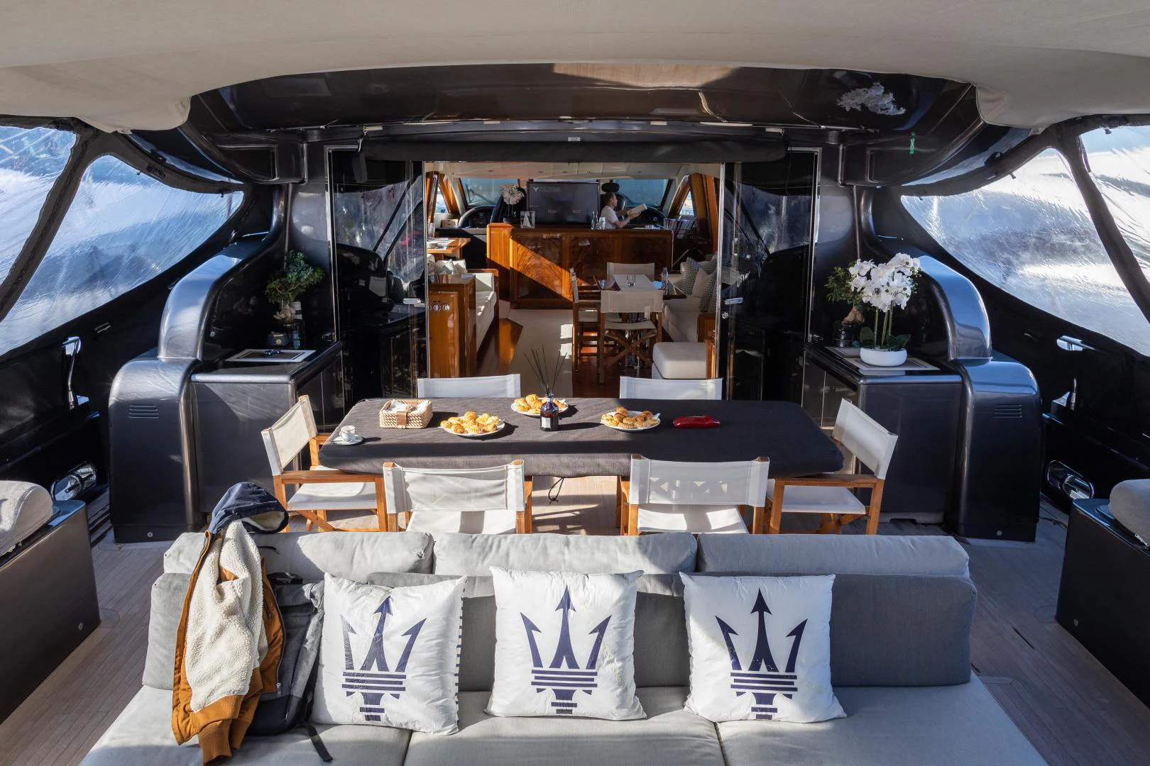 a dining room with a table and chairs aboard OSE Yacht for Sale