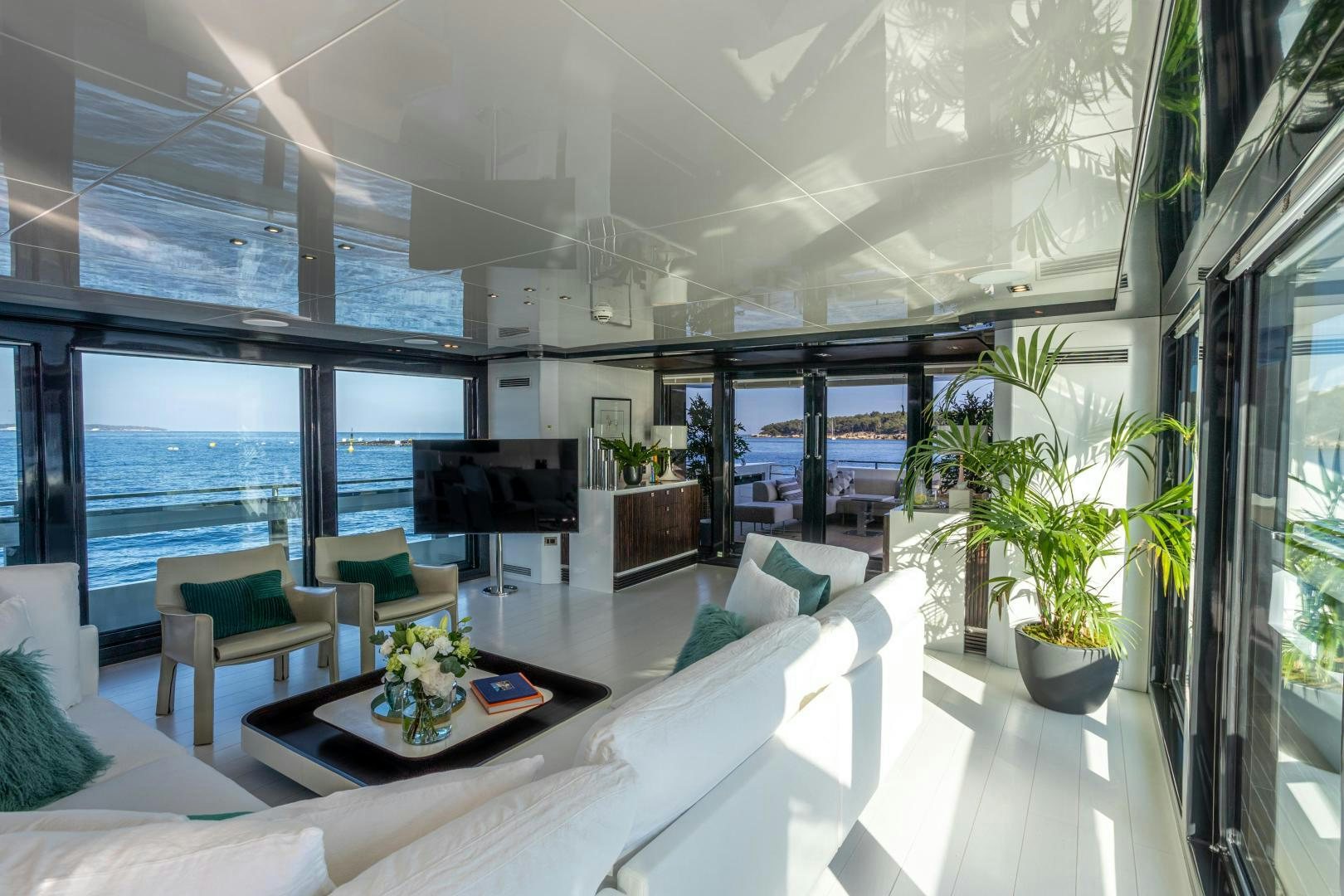 a living room with a large window aboard M Yacht for Sale