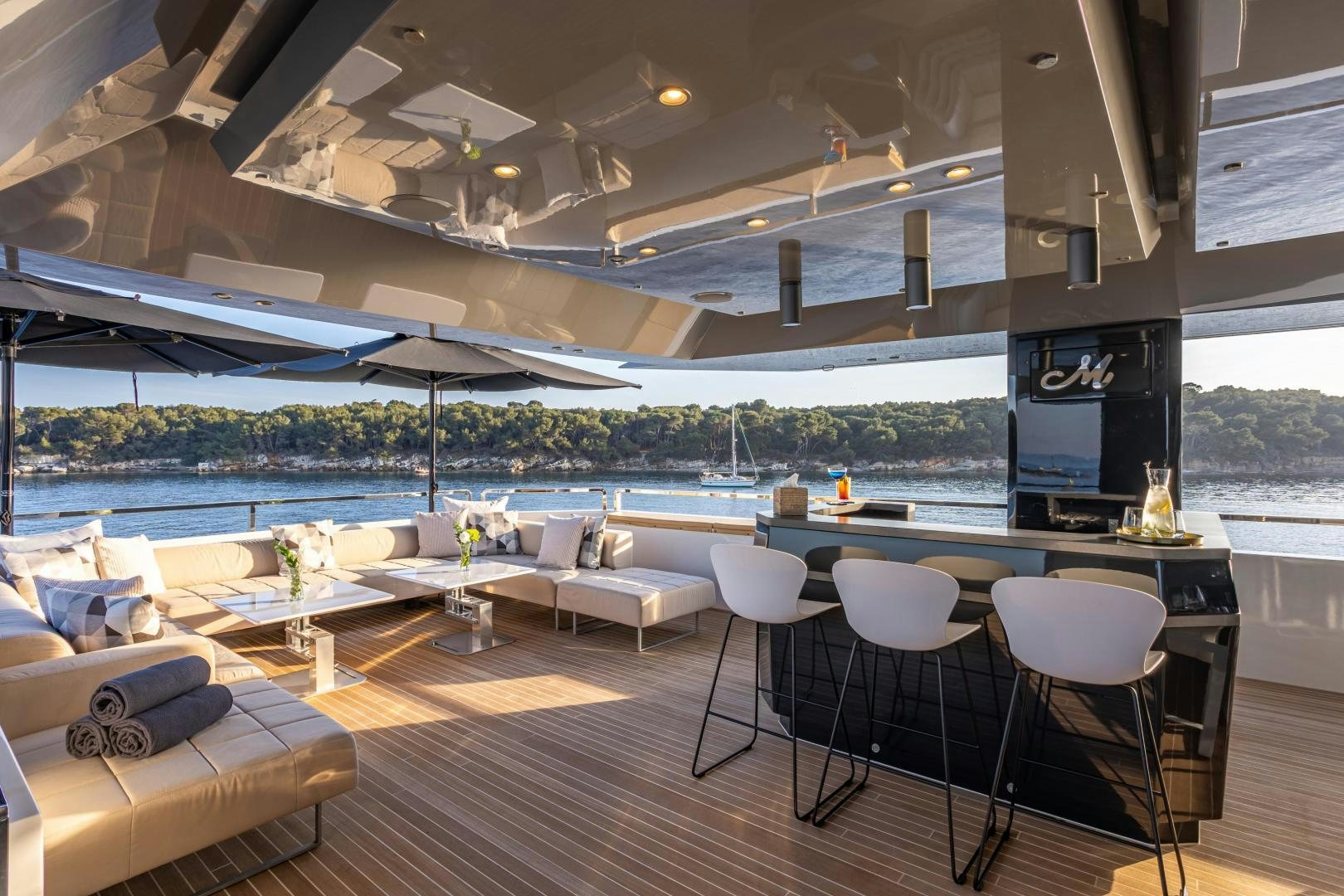a room with a table and chairs aboard M Yacht for Sale