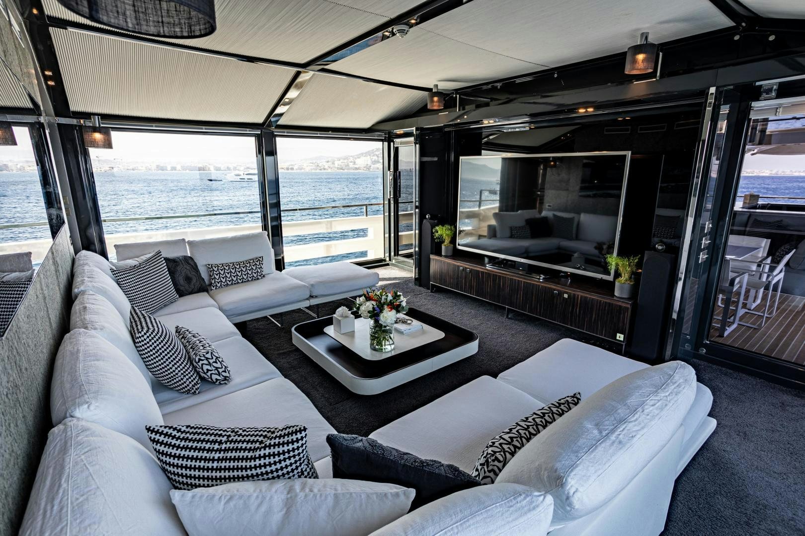 a living room with a large window aboard M Yacht for Sale