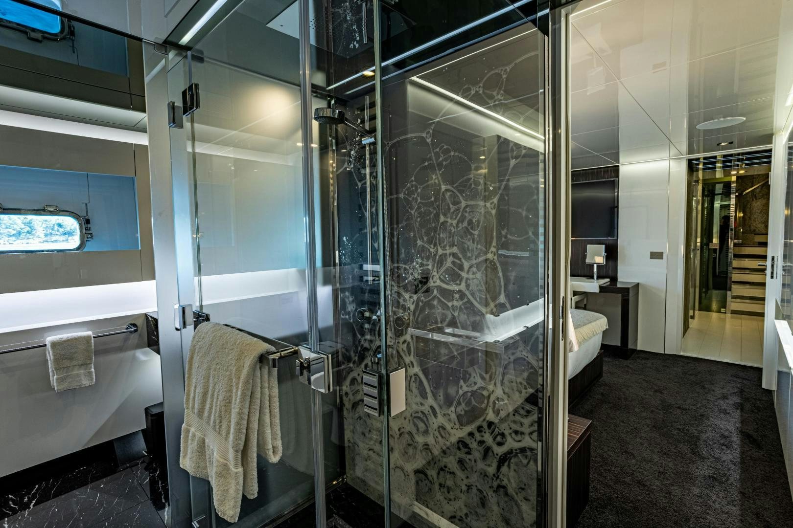 a bathroom with glass walls aboard M Yacht for Sale