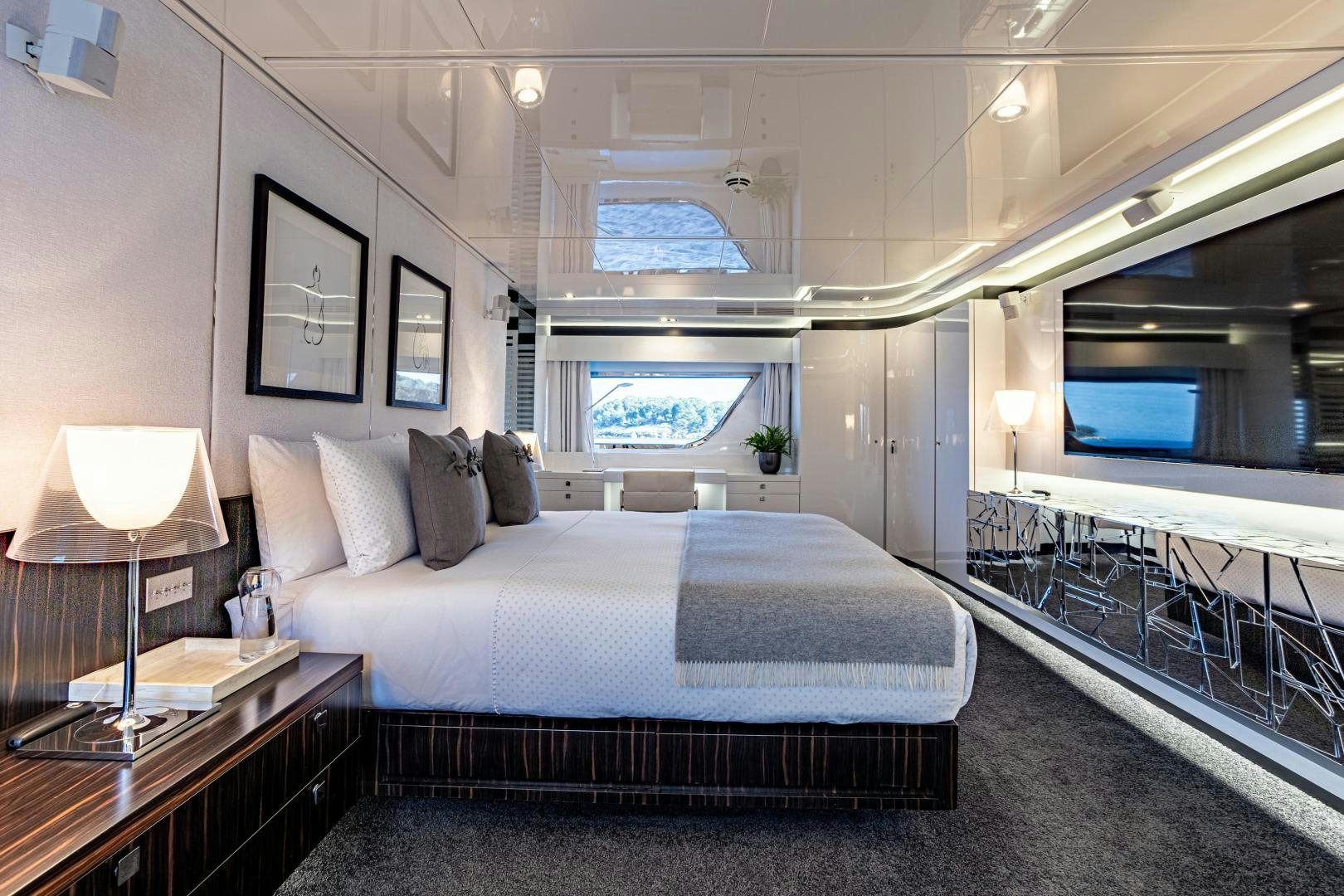 a bed in a room aboard M Yacht for Sale
