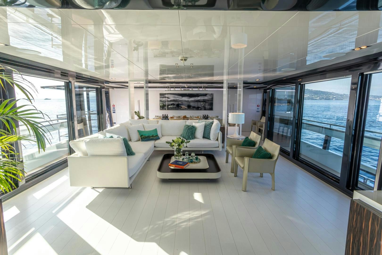 a room with a couch and a table aboard M Yacht for Sale