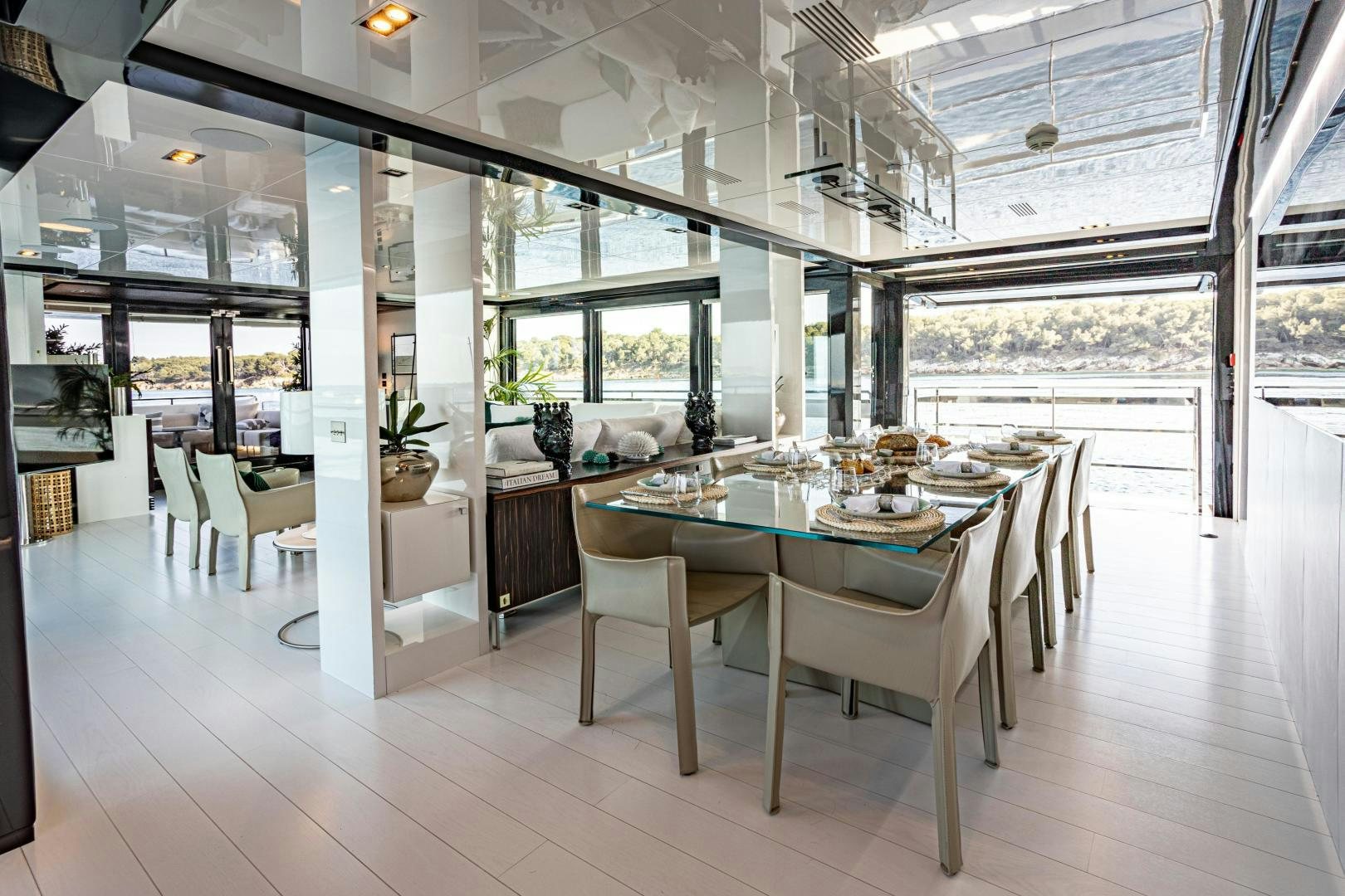 a large room with tables and chairs aboard M Yacht for Sale