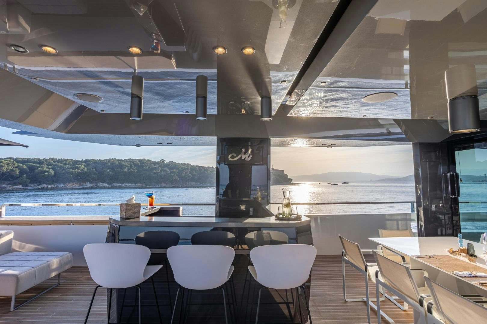 a room with a table and chairs aboard M Yacht for Sale