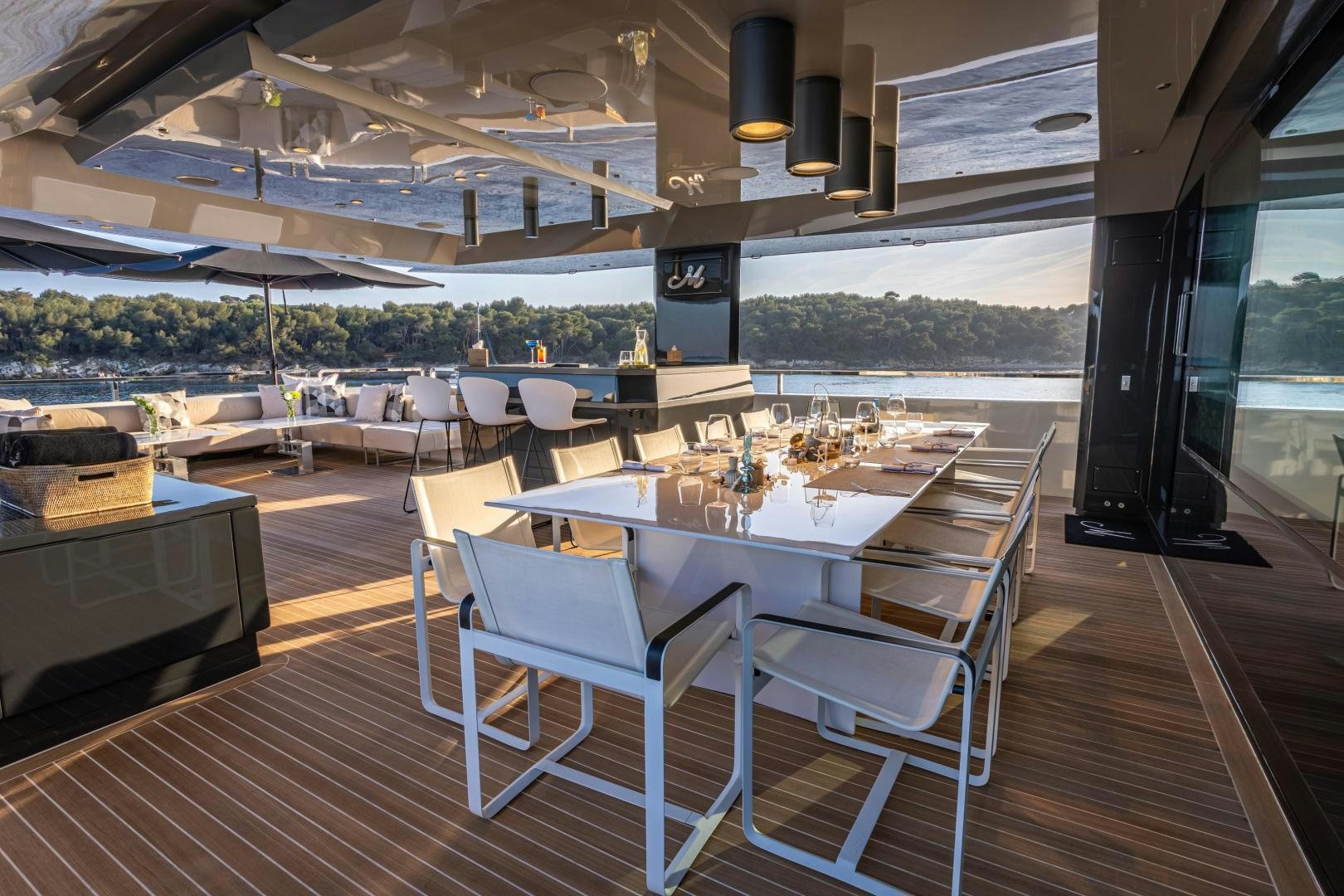a room with tables and chairs aboard M Yacht for Sale