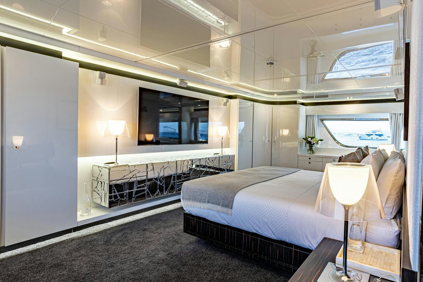 a room with a bed and a couch aboard M Yacht for Sale