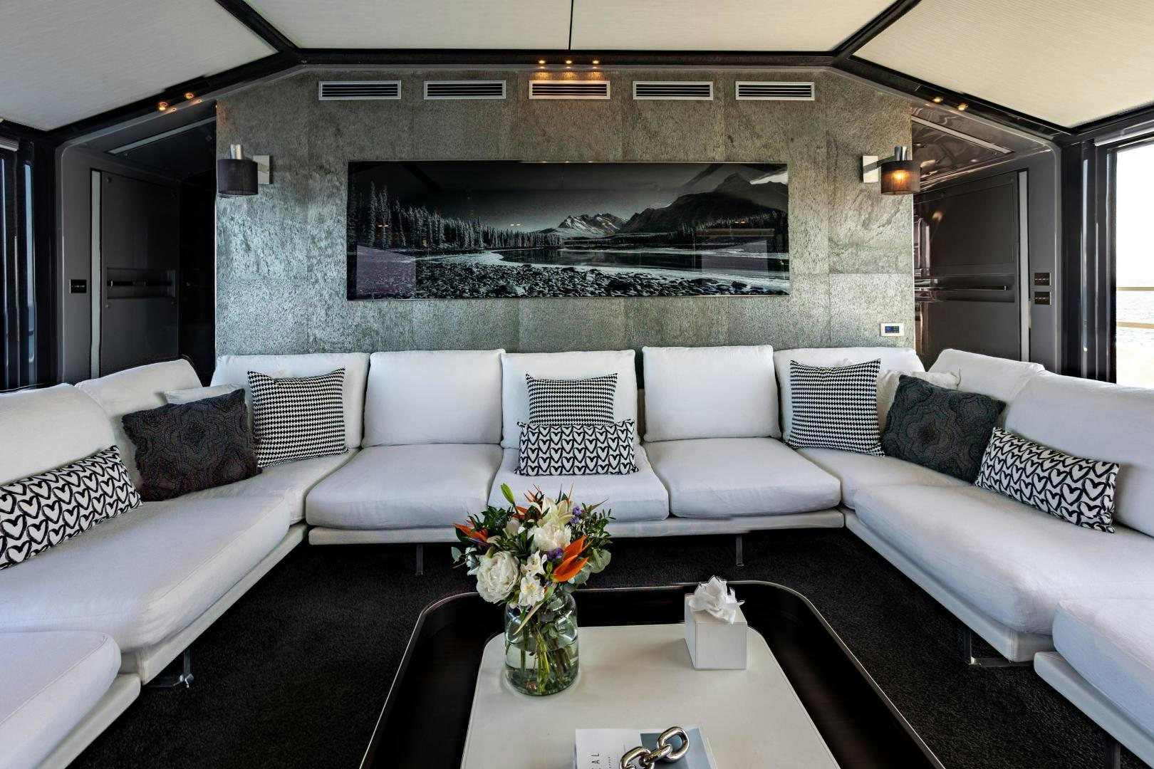 a living room with a white couch and a coffee table aboard M Yacht for Sale