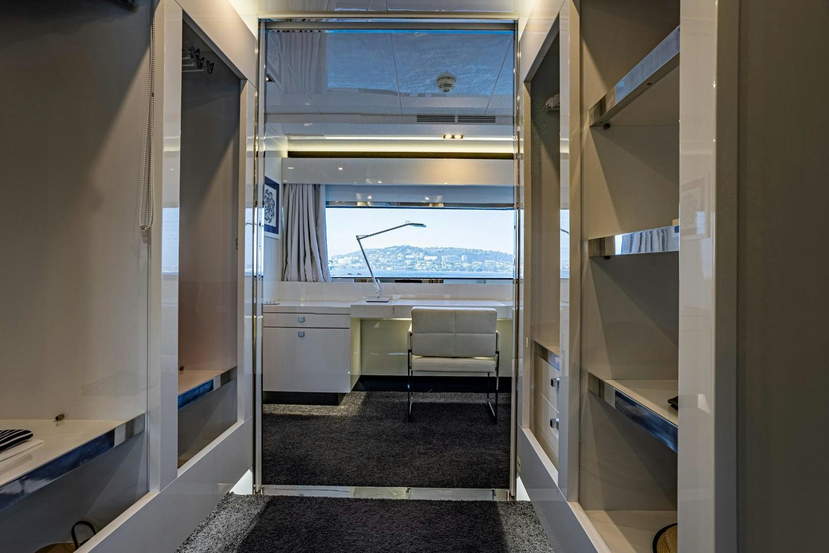 a room with a desk and a window aboard M Yacht for Sale