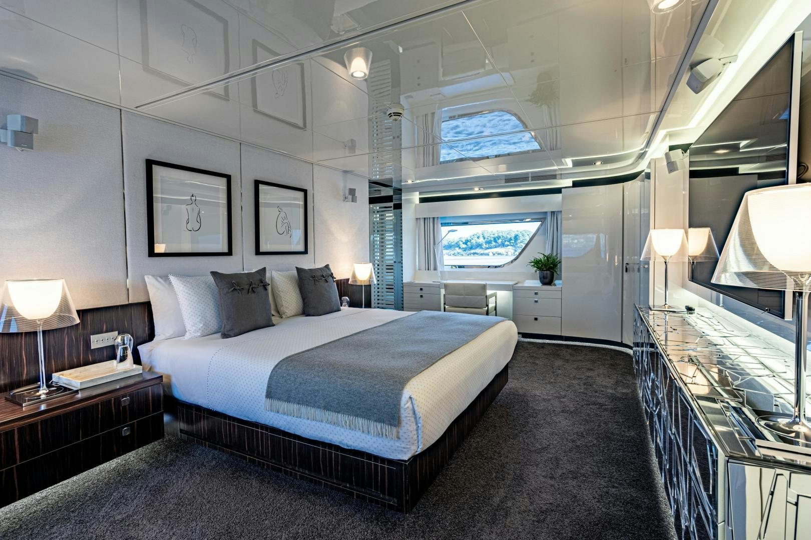 a large bedroom with a large bed aboard M Yacht for Sale