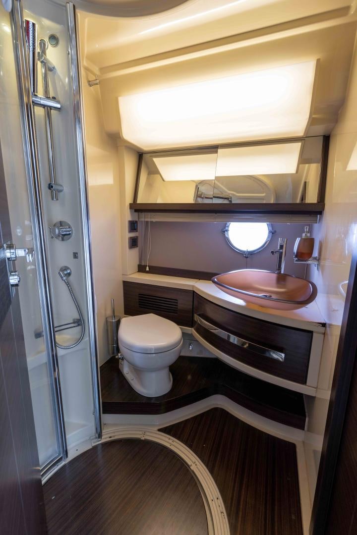 a bathroom with a sink and toilet aboard 4-PLAY Yacht for Sale