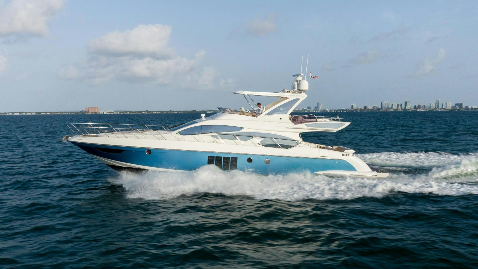 a white boat on the water aboard 4-PLAY Yacht for Sale