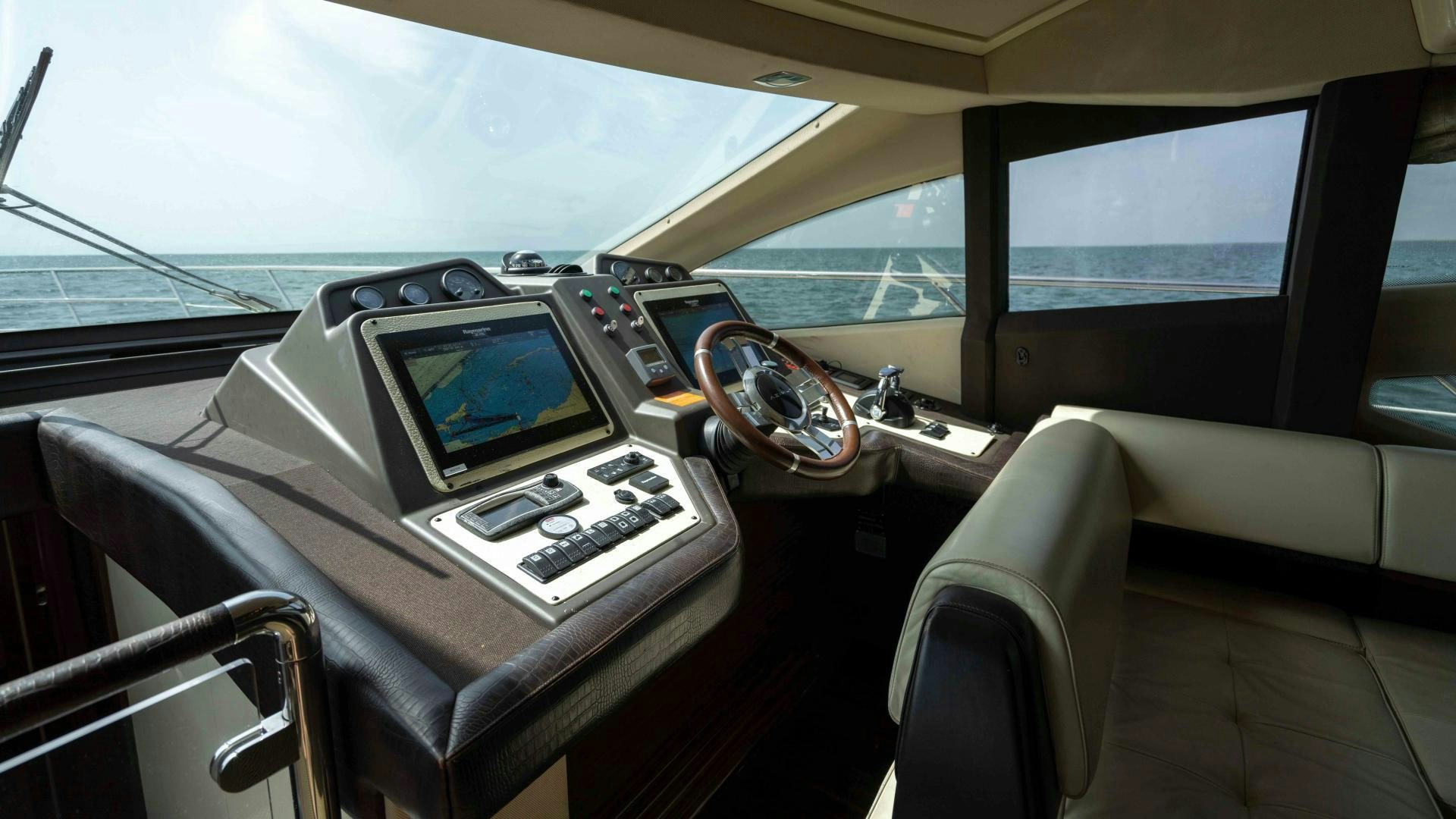 inside of a car aboard 4-PLAY Yacht for Sale