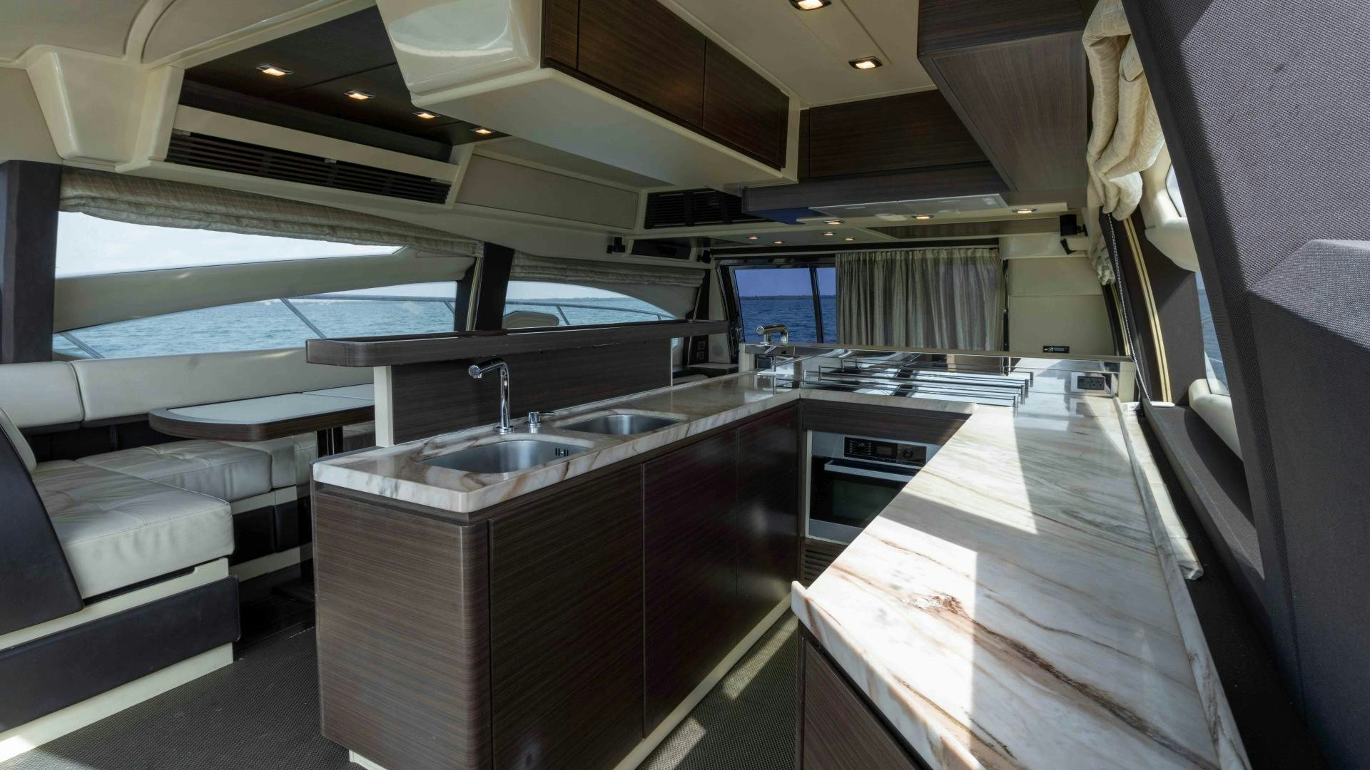 a kitchen with a large window aboard 4-PLAY Yacht for Sale