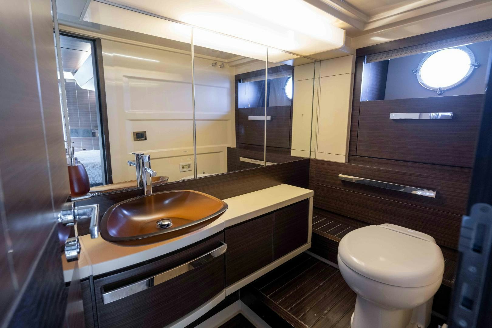a bathroom with a sink and toilet aboard 4-PLAY Yacht for Sale