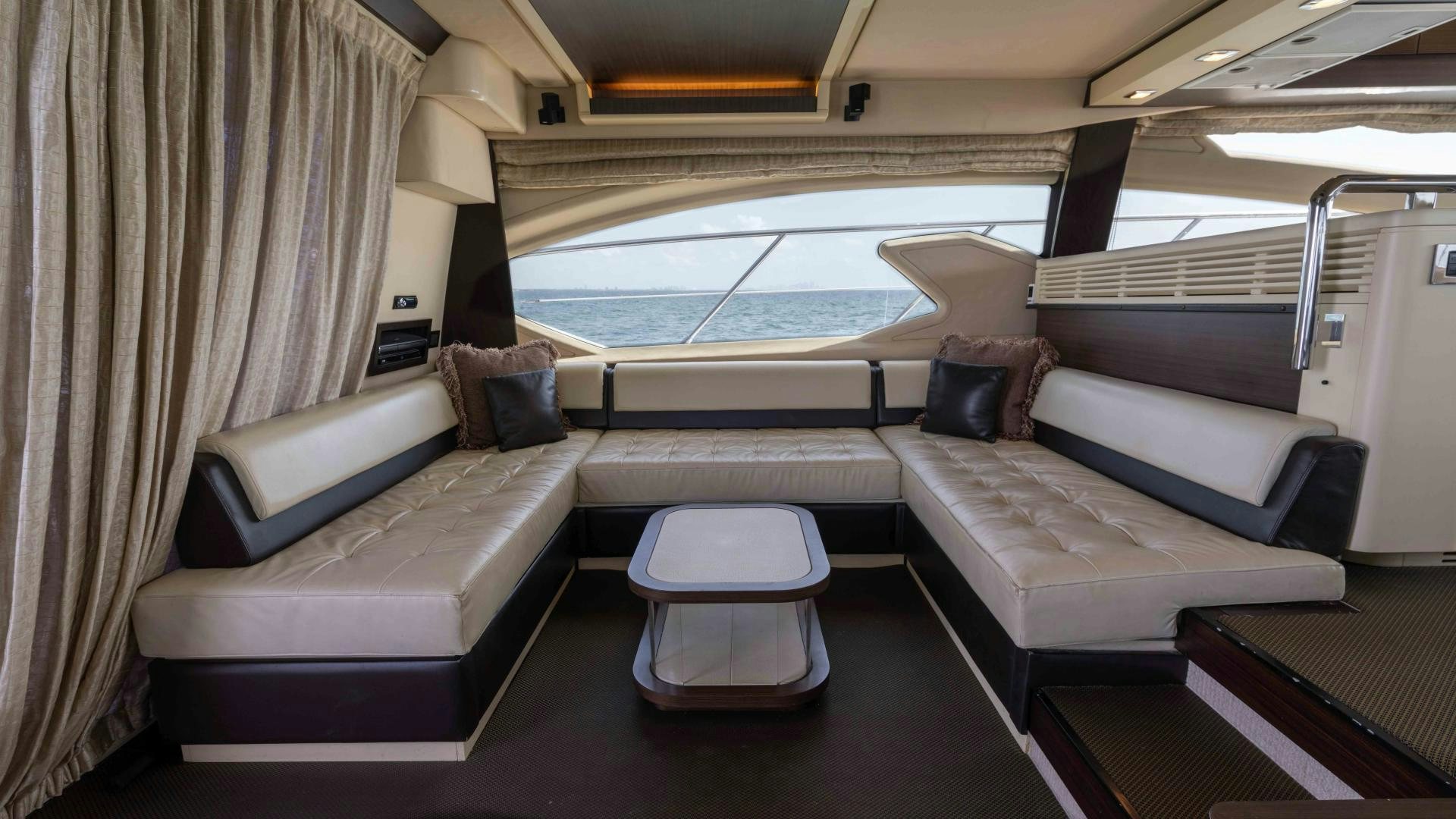 a room with a bed and a couch aboard 4-PLAY Yacht for Sale