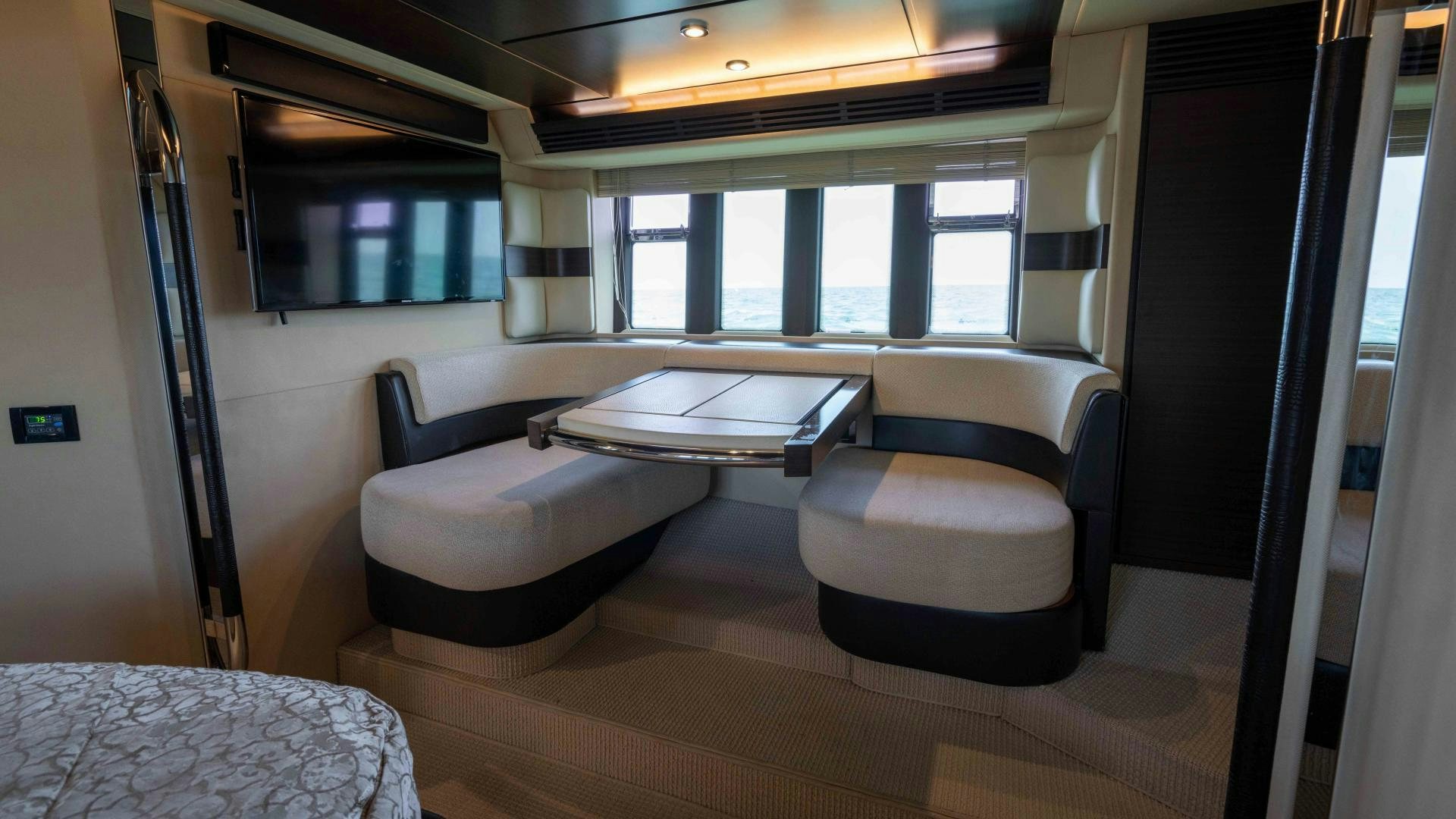a room with a table and chairs aboard 4-PLAY Yacht for Sale