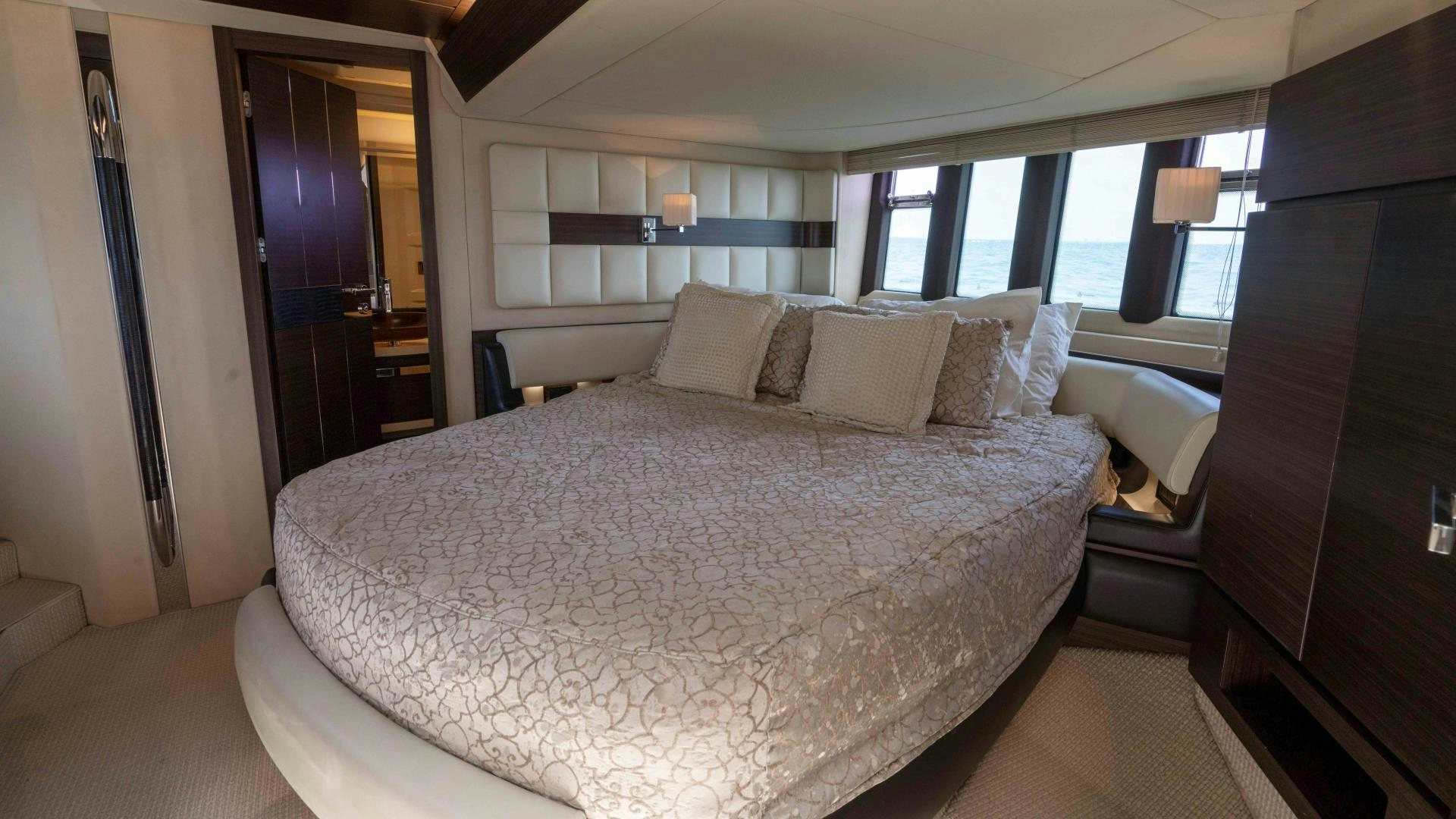a large bed in a hotel room aboard 4-PLAY Yacht for Sale