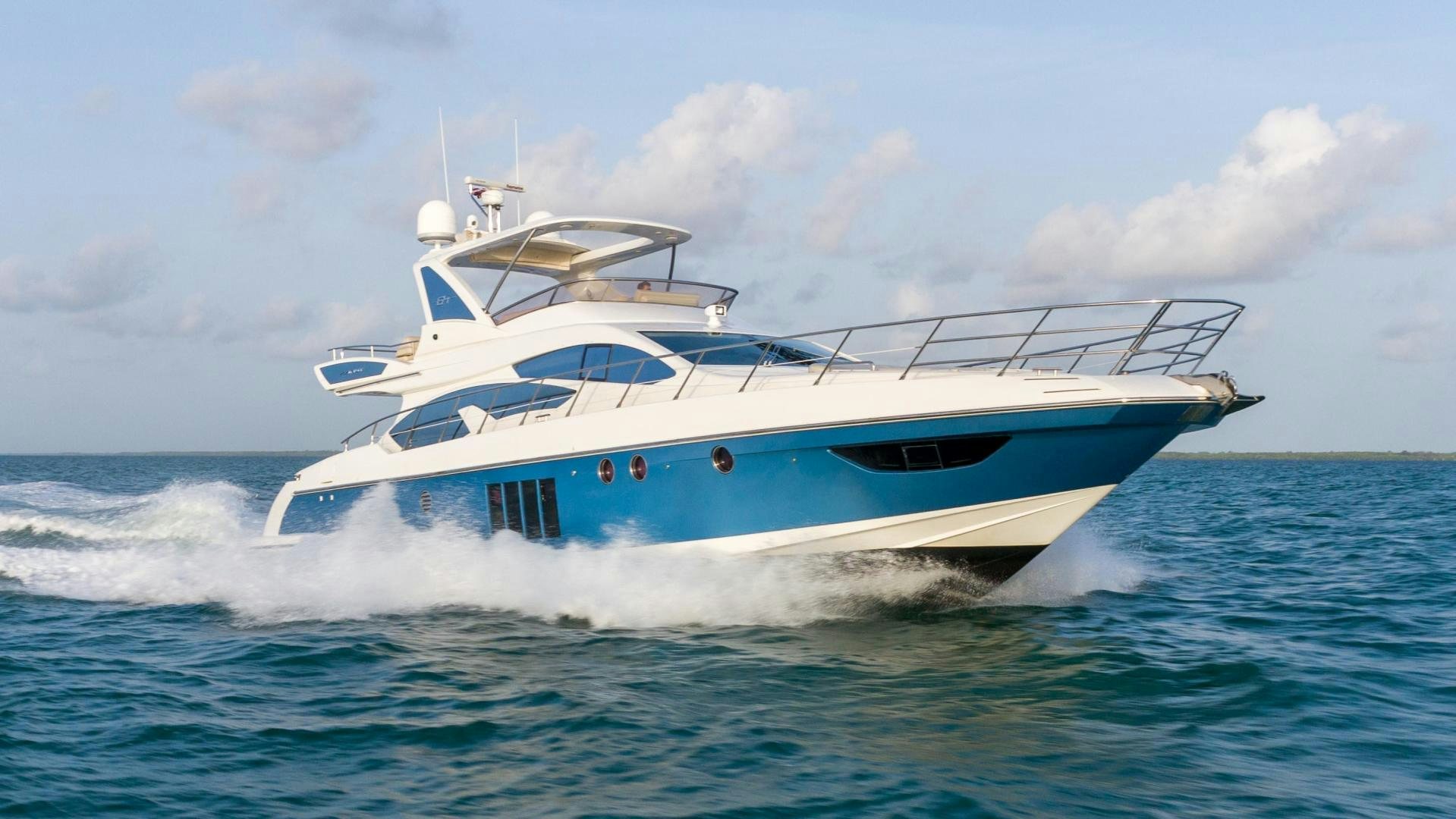 a white boat in the water aboard 4-PLAY Yacht for Sale