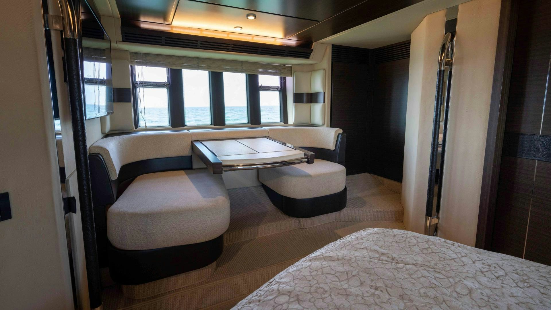 a room with a bed and a table aboard 4-PLAY Yacht for Sale